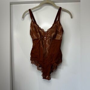 Light Brown bodysuit. Never worn.